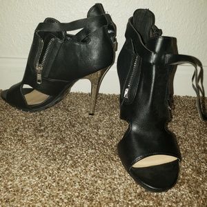 Black and chrome colored open toe heels